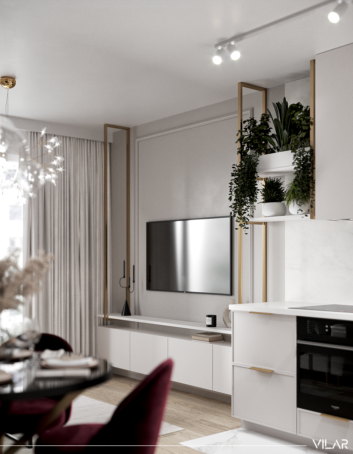 beżowo biały salon z kuchnią i złotymi dodatkami